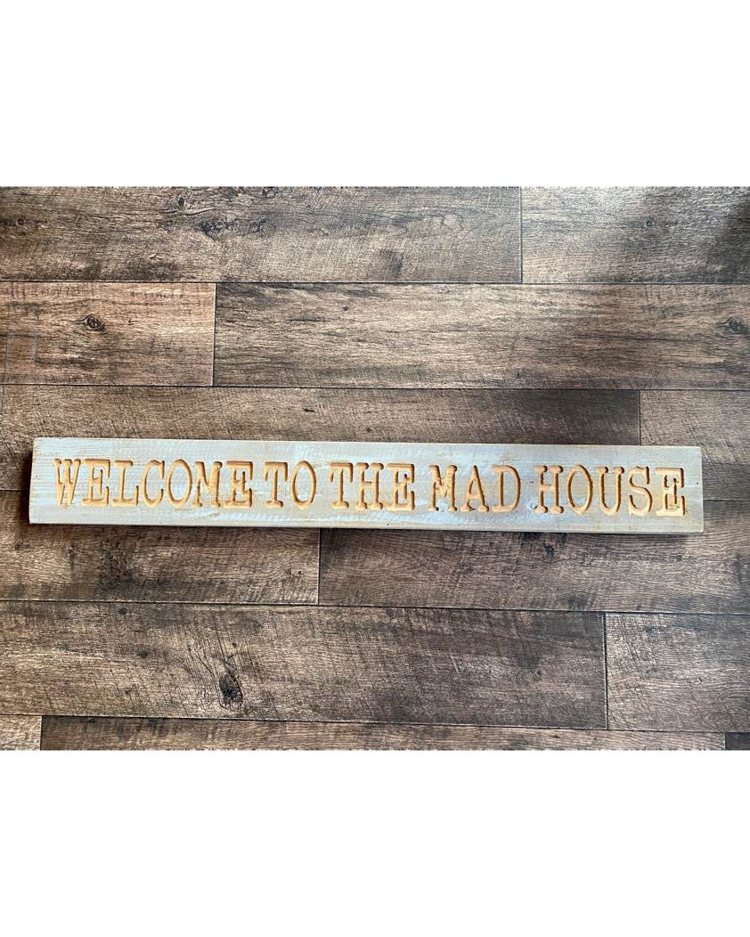 Welcome To The Mad House' Sign