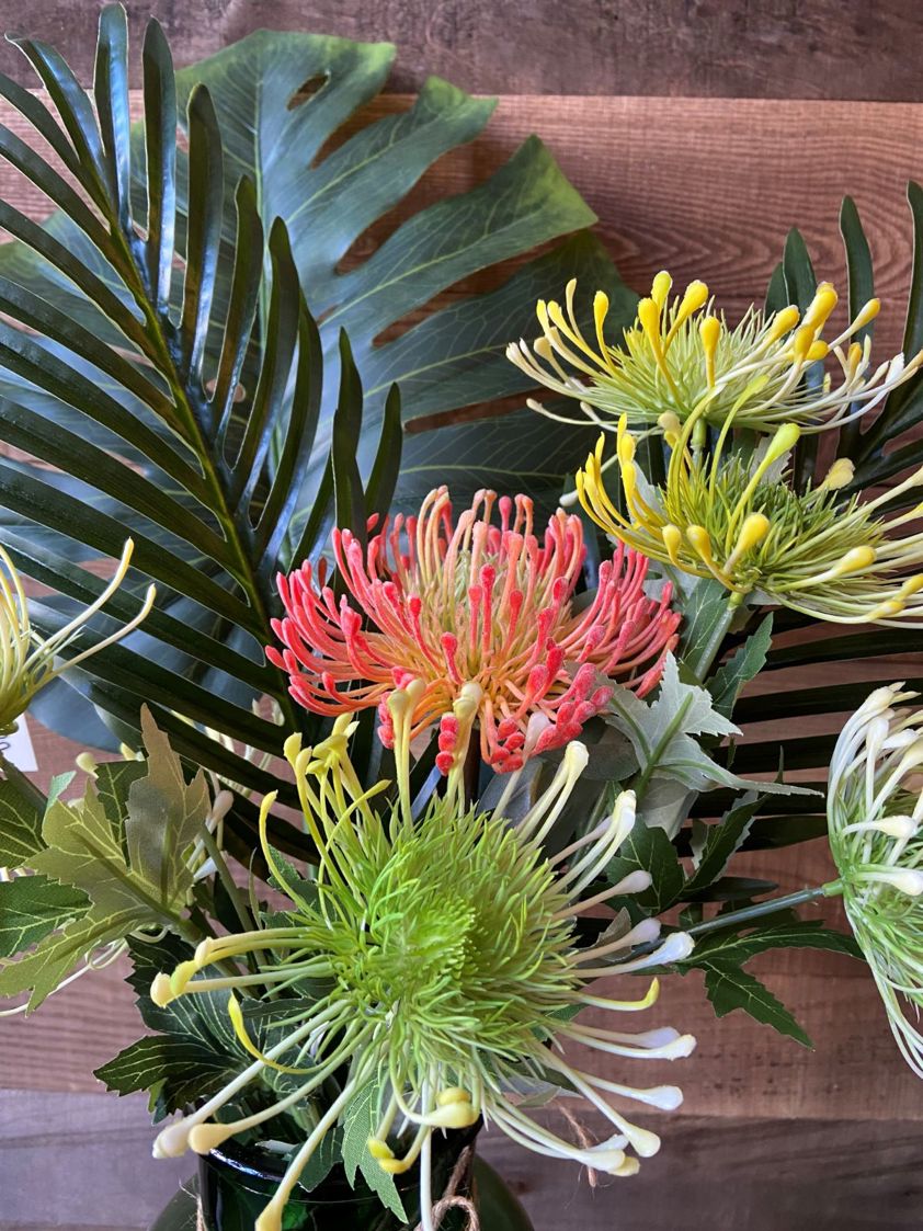 Tropical Palm Bunch in a Green Glass Vase