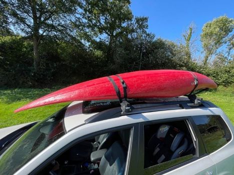 Kayak secured to roof