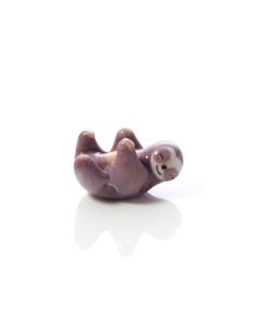 Glass Sloth Ornament Lying On Back