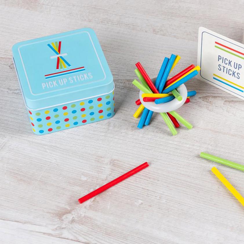 Wooden pick up sticks in a tin