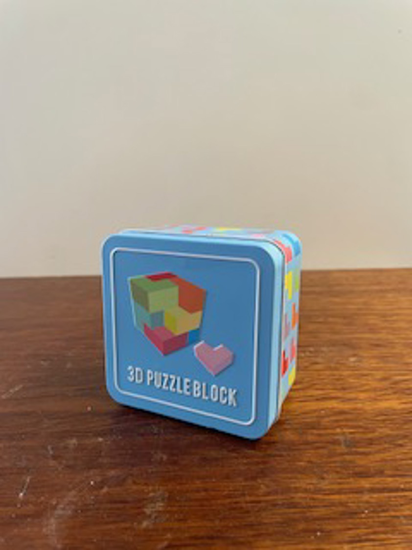 Wooden 3D puzzle in a tin
