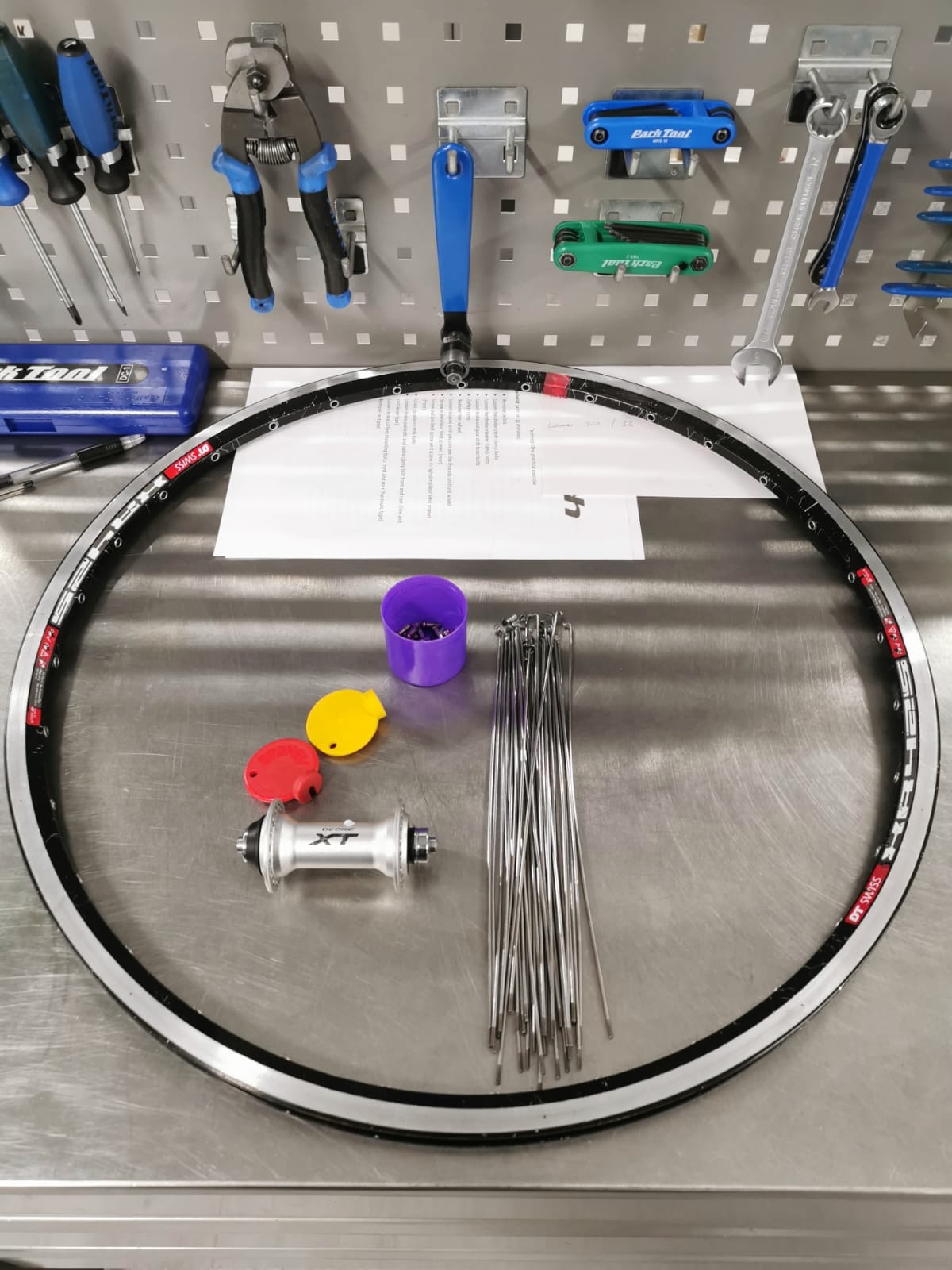 Hand-built bicycle wheel with Shimano XT hub and spokes at Aztec's Bikes workshop in Bow, East London
