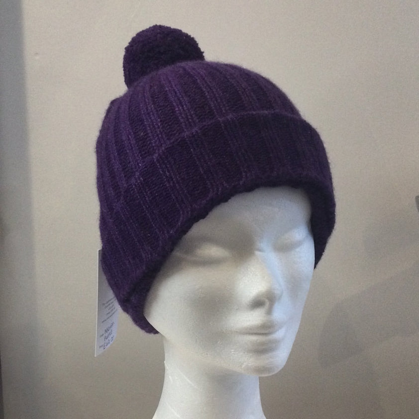 The Cashmere Cabin 100 Cashmere PomPom Beanie Hat from the Cashmere